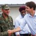 Canada's Prime Minister Justin Trudeau, accompanied by Canada's Defence Minister Harjit Sajjan, shakes hands with Albanian soldiers as he visits NATO eFP Canadian-led battlegroup troops in Adazi military base, Latvia July 10, 2018. REUTERS/Ints Kalnins
