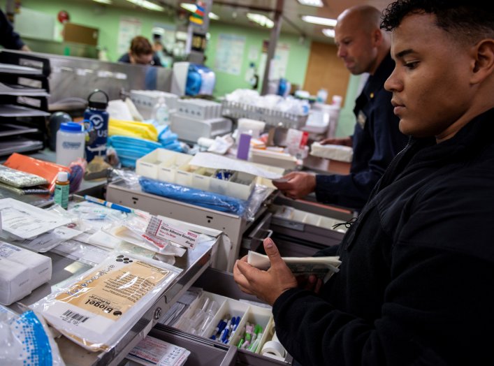 Hospitalman Jeremiah Lewis, from San Antonio, organizes medical supplies aboard the Military Sealift Command hospital ship USNS Mercy off the coast of southern California March 24, 2020. Picture taken March 24, 2020. U.S. Navy/Mass Communication Specialis