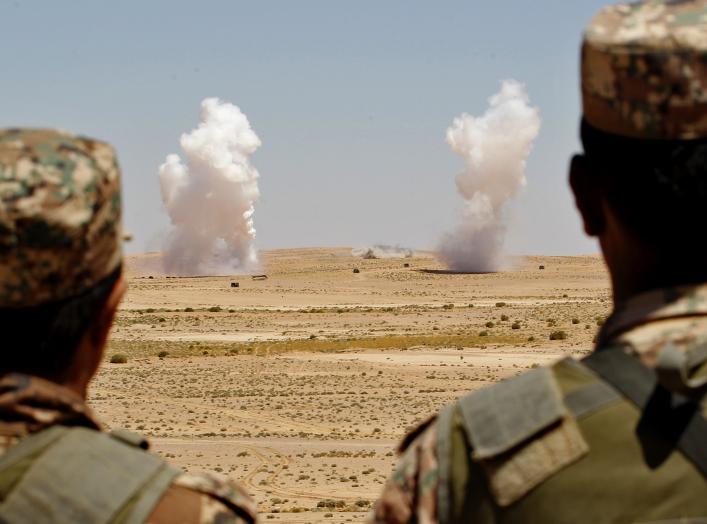 Jordanian soldiers watch smoke rising during an artillery drill, part of the "Eager Lion" military exercise near the southern town of Al Quweira, 50 km (30 miles) from the coastal city of Aqaba, June 19, 2013. Eager Lion military exercise, set to take pla